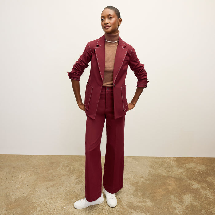 front image of a woman wearing the milo jean in berry jam