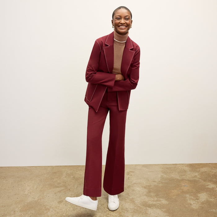front image of a woman wearing the milo jean in berry jam