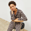 Front image of a woman wearing the Petite Plume x M.M. Astaire Pajama Set in Sahara Print | Lead