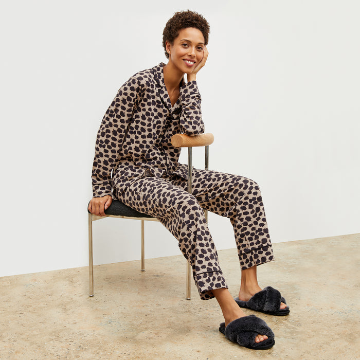Front image of a woman wearing the Petite Plume x M.M. Astaire Pajama Set in Sahara Print