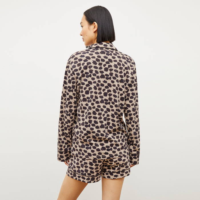 Back image of a woman wearing the Petite Plume x M.M. Long Sleeve Short Set in Sahara Print