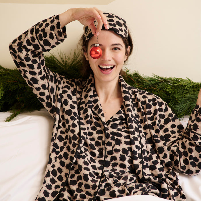 Front image of a woman wearing the Petite Plume x M.M. Luxe Pima Robe in Sahara Print