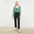 Front image of a woman wearing the monica top in spring green | Lead