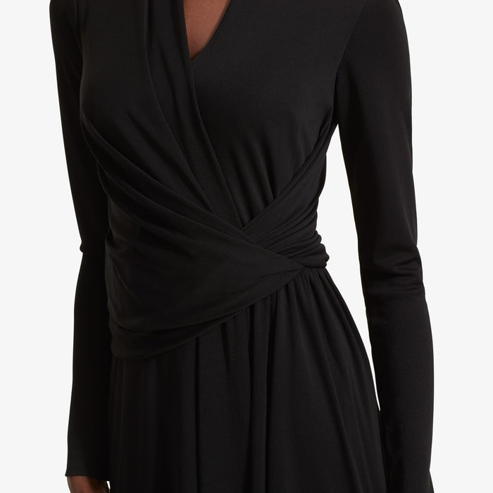 Detail image of a woman standing wearing the Morgan dress in Black