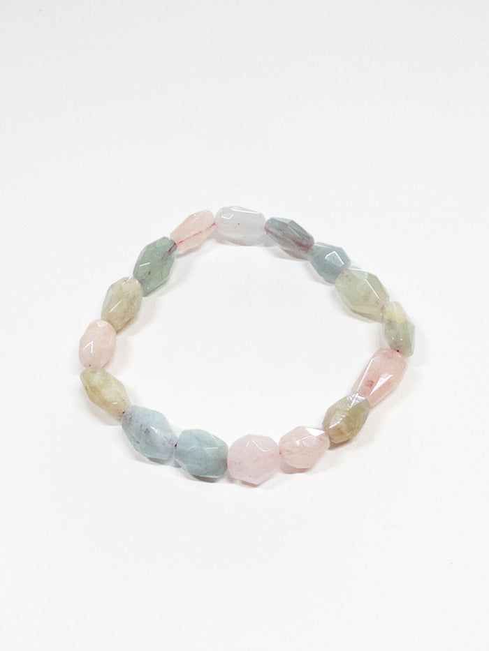A beaded bracelet with Morganite stones, displayed against a plain background.
