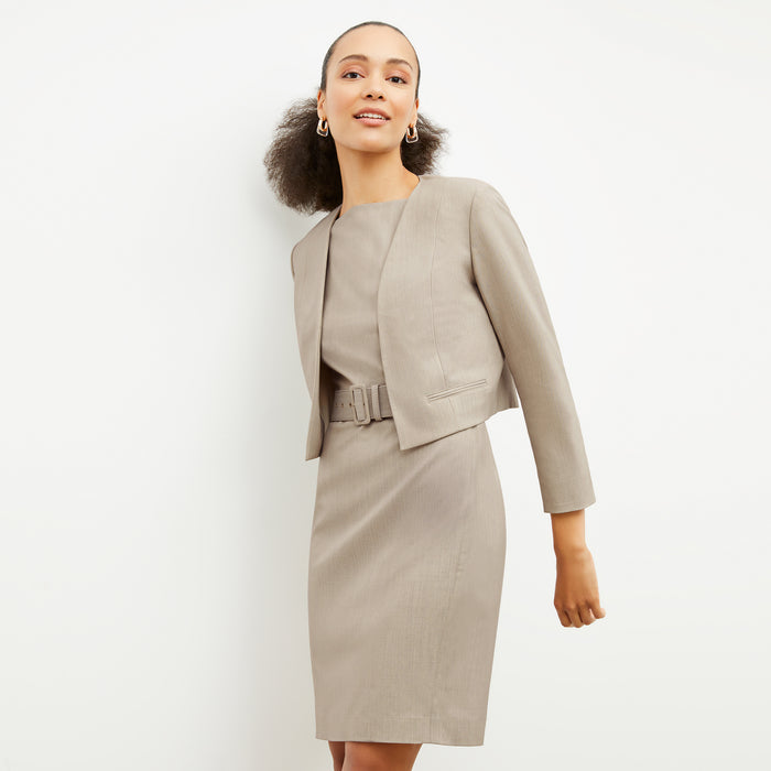 Side image of a woman wearing the Neale Jacket in Natural Melange