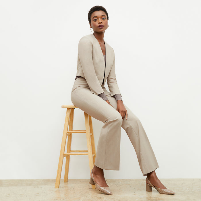 Side image of a woman wearing the Neale Jacket in Natural Melange