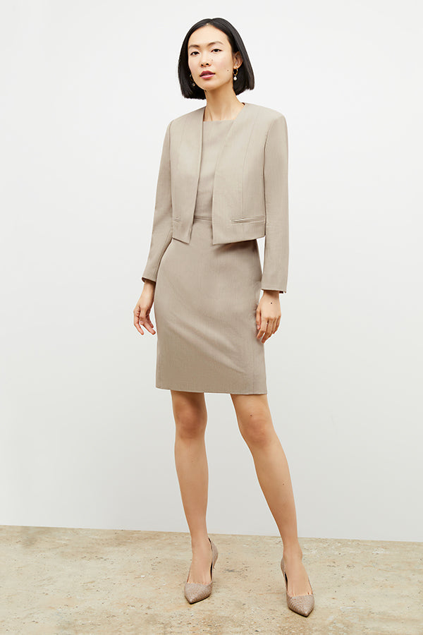Front image of a woman wearing the Neale Jacket in Natural Melange | Exclude