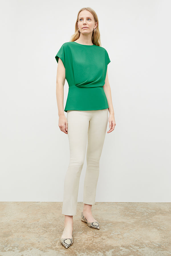 Front image of a woman in the nora top in clover | Exclude | Grid