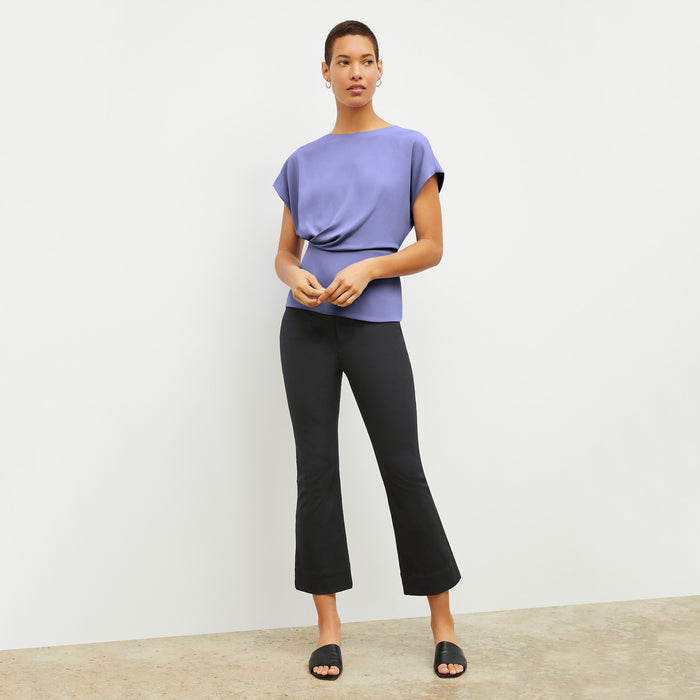 Front image of a woman wearing the Nejvi Top in Iris