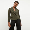 Front image of a woman wearing the nia jacket in olive | Lead