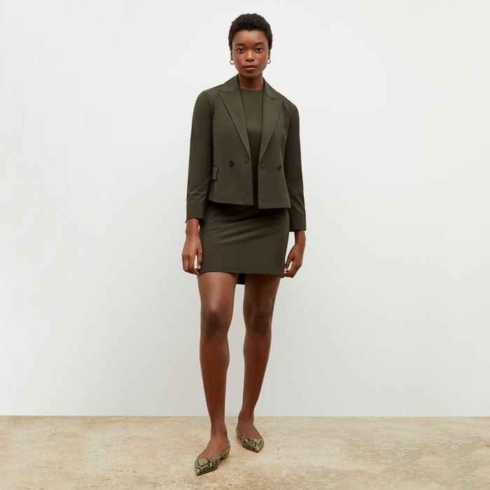 Front image of a woman wearing the nia jacket in olive