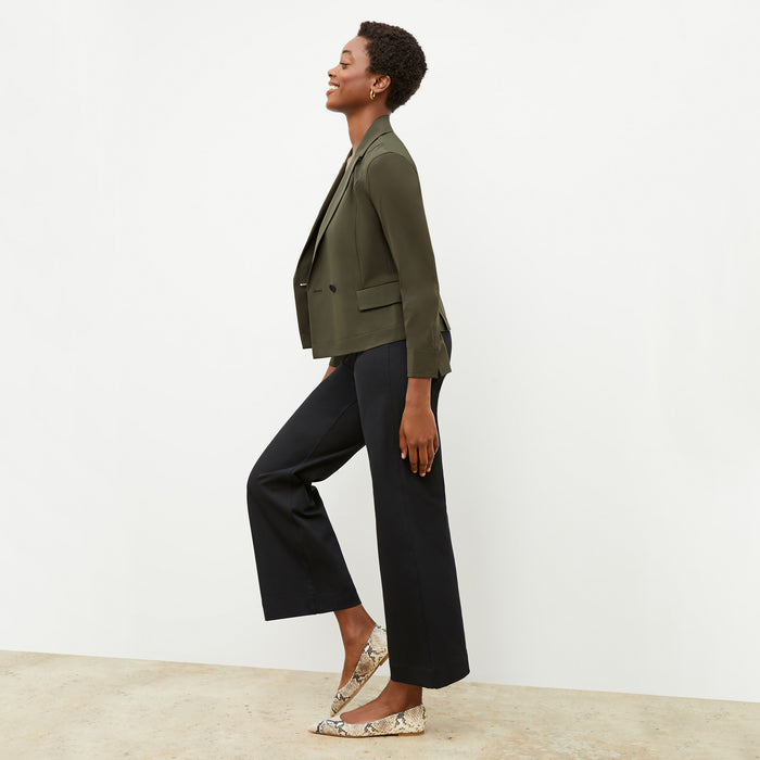 Front image of a woman wearing the nia jacket in olive