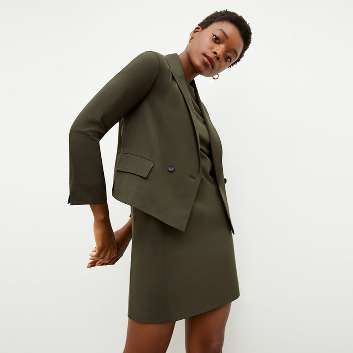 Front image of a woman wearing the nia jacket in olive