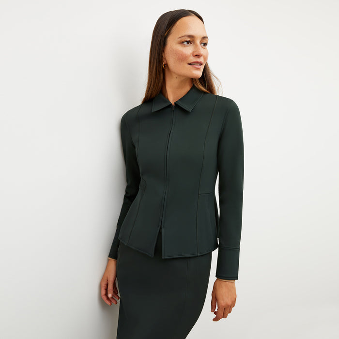 Image of a woman wearing the Nita Jacket in Forest