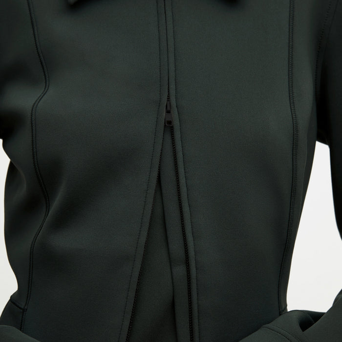 Image of a woman wearing the Nita Jacket in Forest
