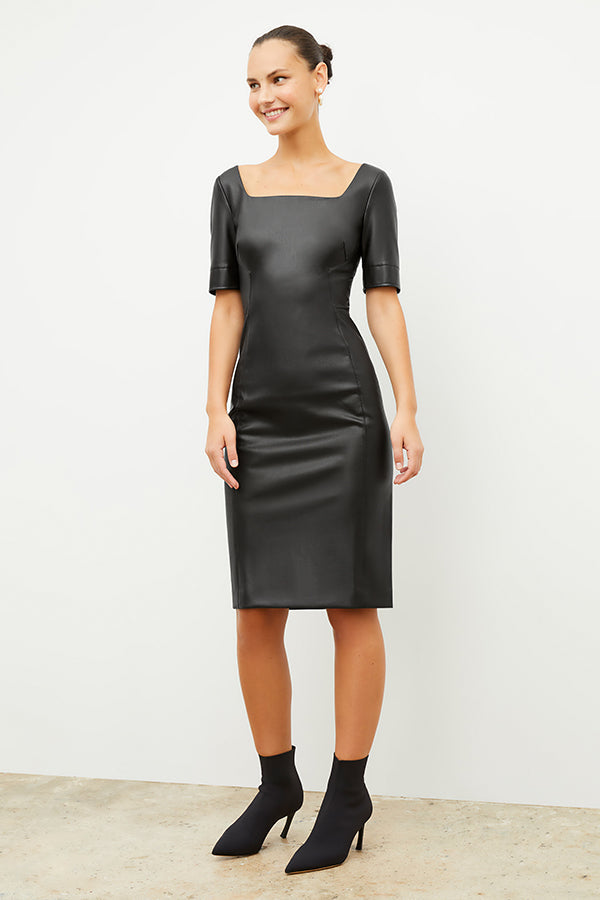Front image of a woman wearing the noa dress in black | Exclude | Grid | Still