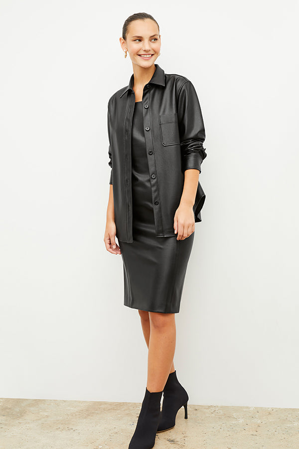 Front image of a woman wearing the noa dress in black | Exclude