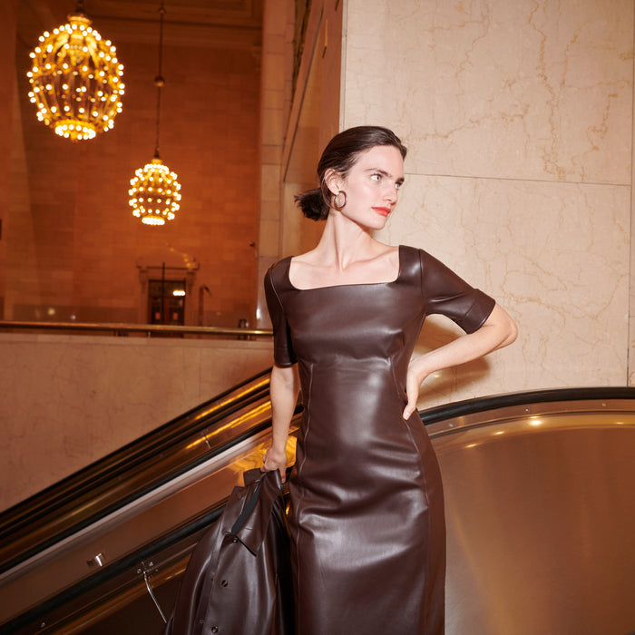 woman wearing the noa dress in brown