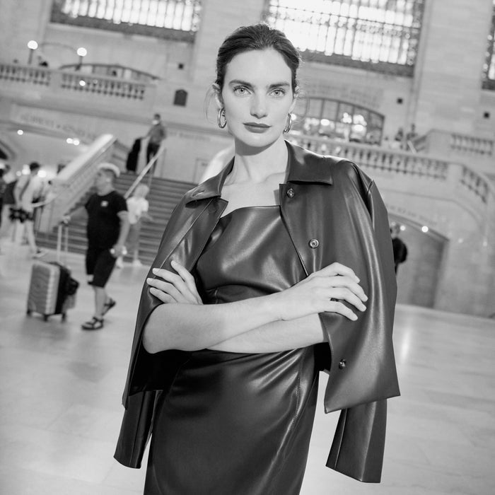 woman wearing the noa dress in brown