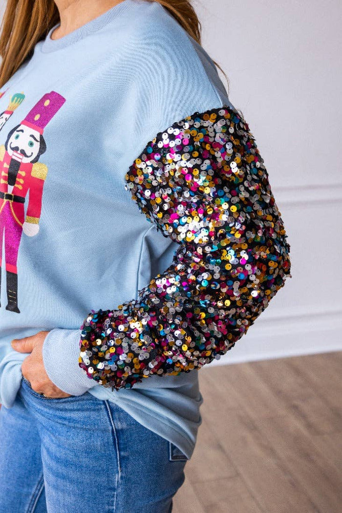 Nutcrackers on Blue Top with Sequin Sleeves