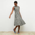 Front image of a woman wearing the nyla dress in black and white | Lead