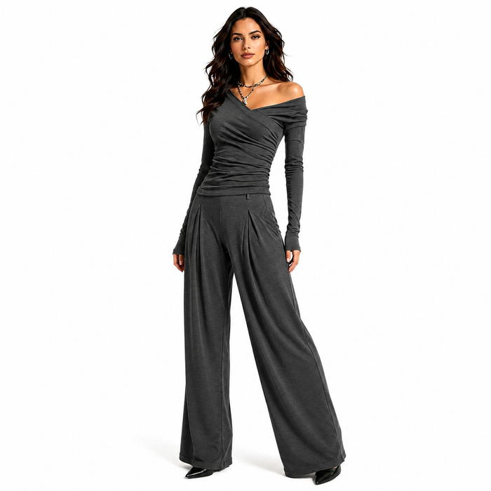 Charcoal women's two piece pants set with off shoulder ruched top and wide leg trousers shown in a clean studio fashion pose.