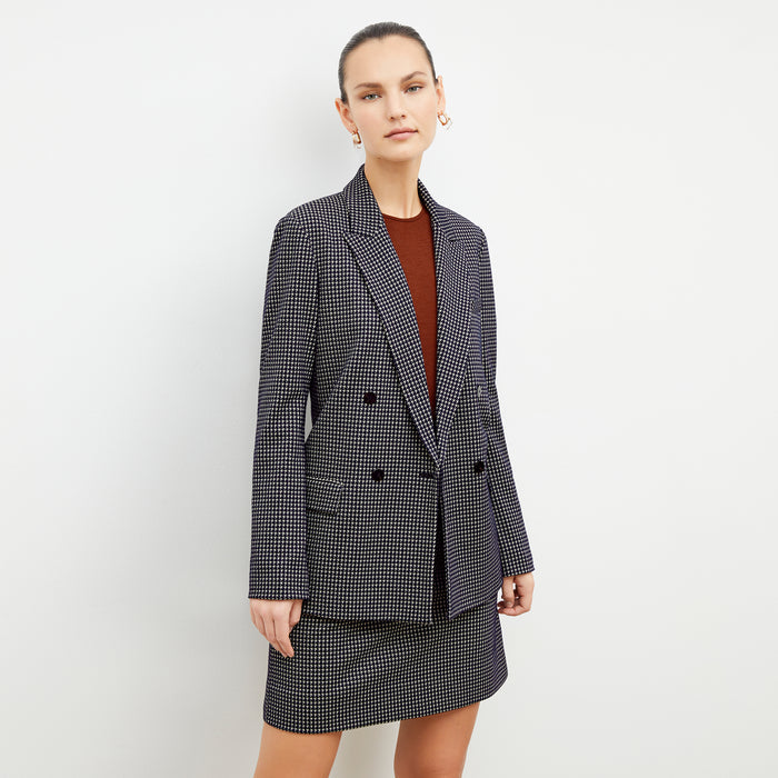 Front image of a woman wearing the ohara blazer in black and white | Lead