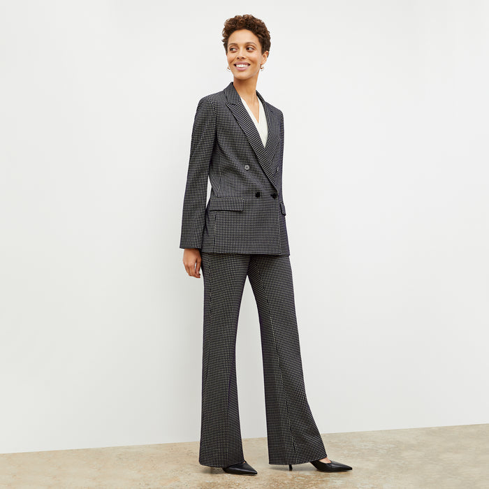 Front image of a woman wearing the ohara blazer in black and white