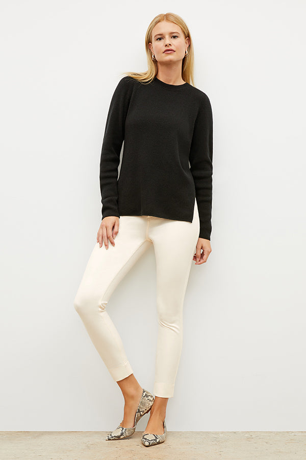 Front image of a woman wearing the ollie sweater in black | Exclude | Grid Hover