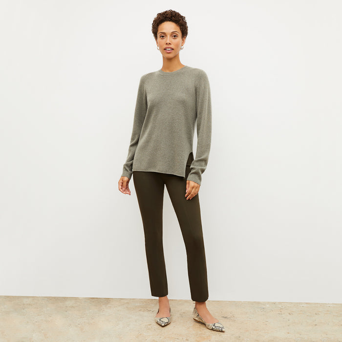 Front image of a woman wearing the ollie sweater in dark moss | Lead