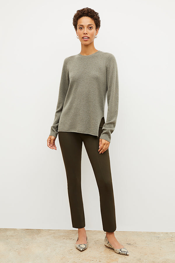 Front image of a woman wearing the ollie sweater in dark moss | Exclude | Grid