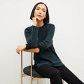 Front image of a woman wearing the ollie sweater in malachite | Lead