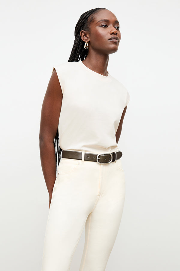 front image of a woman wearing the oval buckle belt in olive | Exclude | Grid Hover