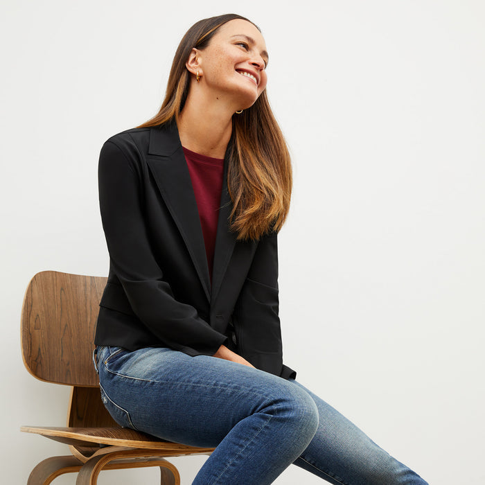 Front image of a woman wearing the owen tshirt in maroon