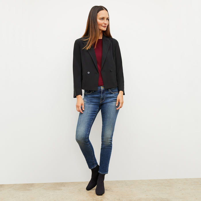 Front image of a woman wearing the owen tshirt in maroon