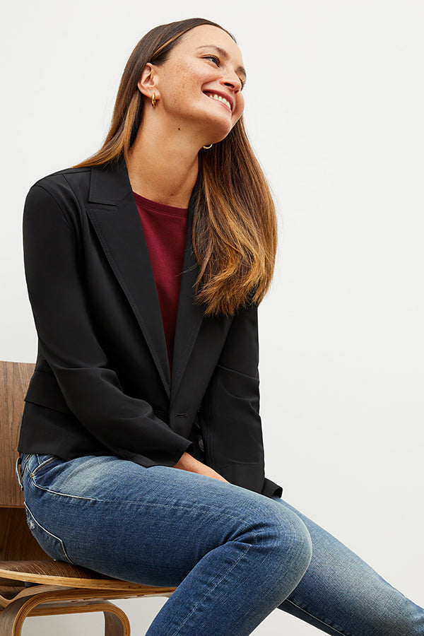 Front image of a woman wearing the owen tshirt in maroon | Exclude