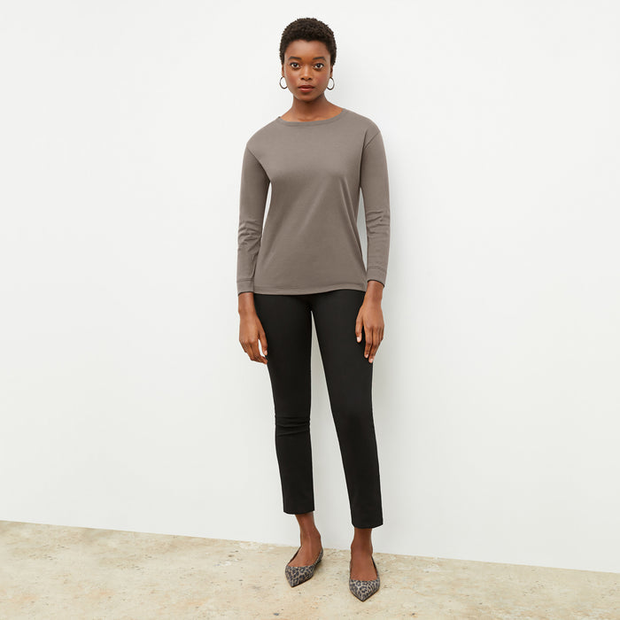 Front image of a woman wearing the owen t shirt in pebble | Lead
