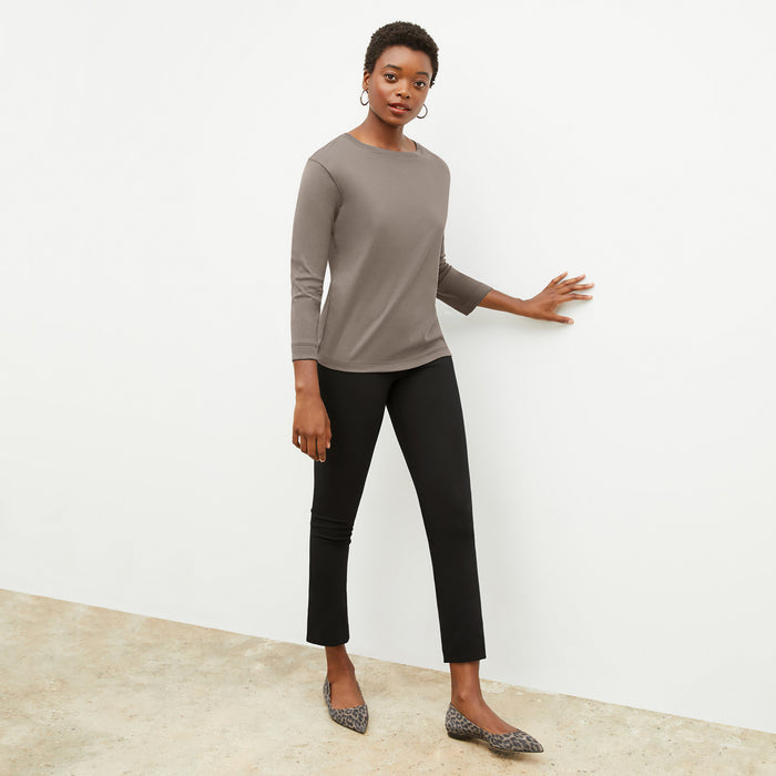 Front image of a woman wearing the owen t shirt in pebble