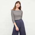 front image of a woman wearing the owen t-shirt in thistle | Lead