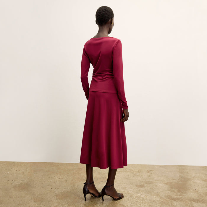 back image of a woman wearing the percy top in grenache