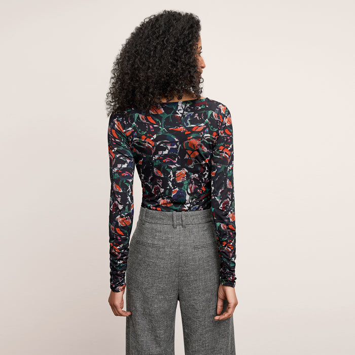 back image of a woman wearing the percy top in splatter pop