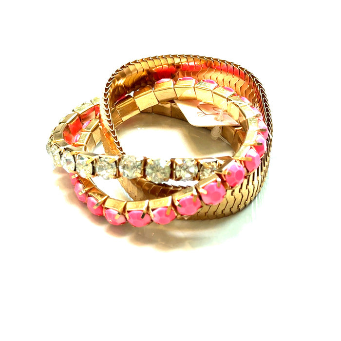 Pink and clear rhinestone multistrand bracelet with gold tone bands and layered light-catching sparkle.