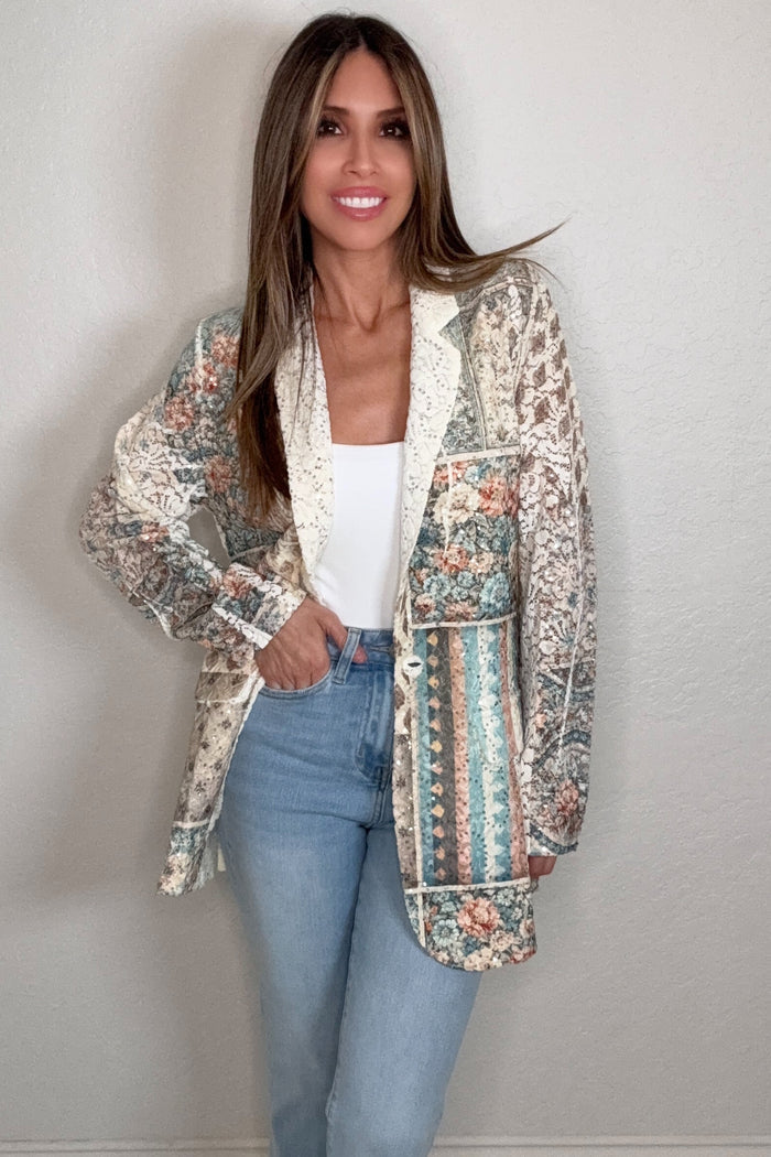 Blue floral patch lace sequin blazer jacket with sheer lace texture, button front, and shimmering patchwork embellishment.
