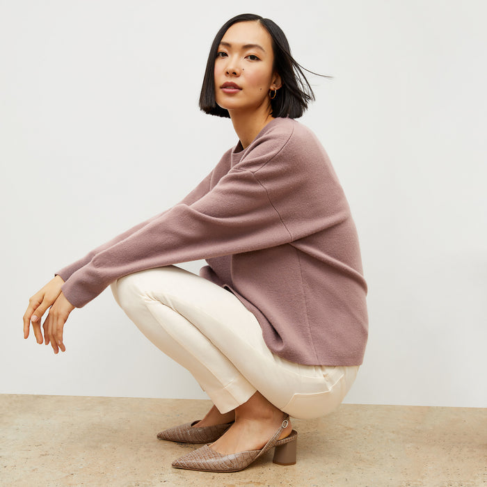 Front image of a woman wearing the quincy sweater in rose taupe