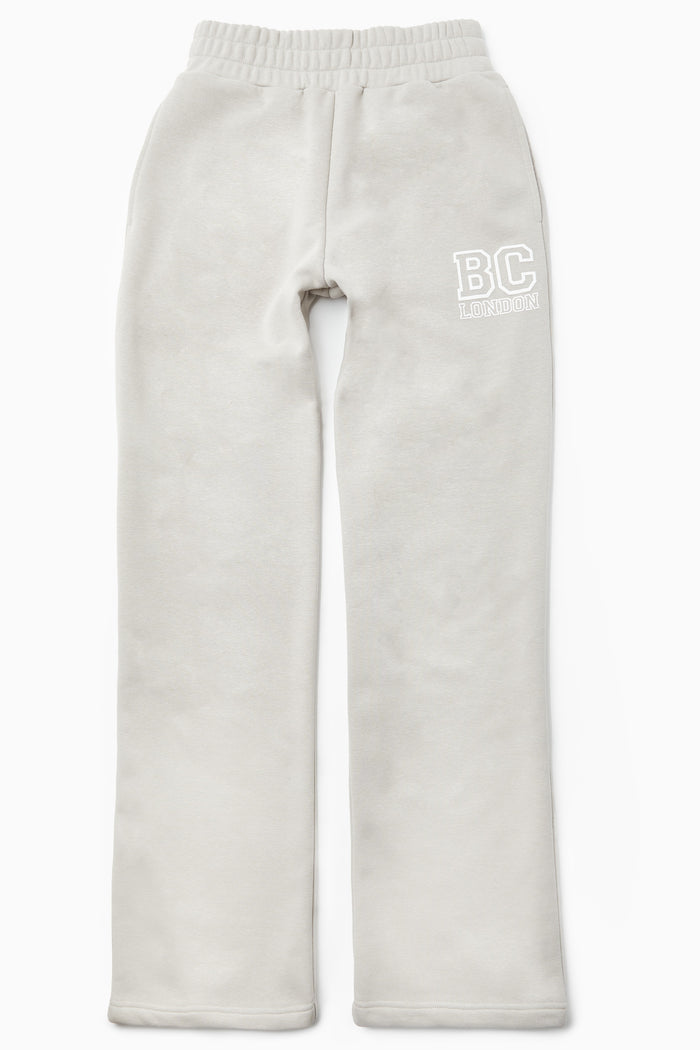 Light grey Ralph Street Wide Leg Tracksuit sweatpants with elastic waistband and BC LONDON logo in white on the upper left leg, laid flat on a white background.