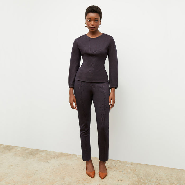 Front image of a woman wearing the rashida top in navy multi