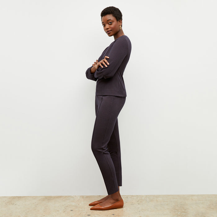 Front image of a woman wearing the rashida top in navy multi