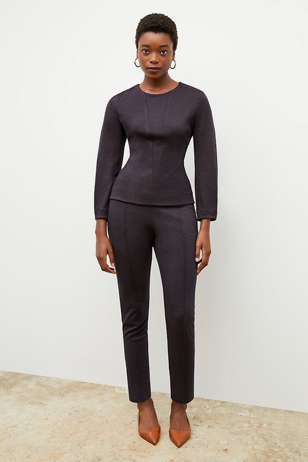 Front image of a woman wearing the rashida top in navy multi | Exclude | Grid Hover