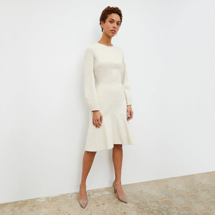 Front image of a woman standing wearing the rashida top in pearl